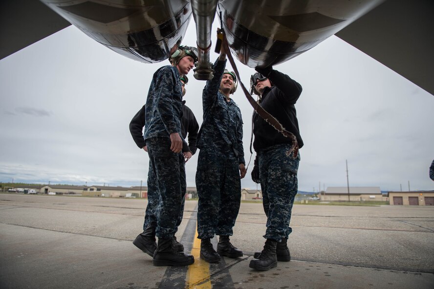 U.S. Navy Sailors from VAQ-137, Naval Air Station Whidbey Island, Washington, inspect the engine exhaust of an EA-18G Growler electronic attack aircraft prior to a sortie May 9, 2016 during RED-FLAG-Alaska (RF-A) 16-1 at Eielson Air Force Base, Alaska. Without the expertise of maintenance Sailors, pilots from VAQ-137 wouldn’t be able to fulfill their mission to provide the best airborne electronic warfare from the sea. (U.S. Air Force photo by Staff Sgt. Shawn Nickel/Released)
