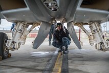 A U.S. Navy Sailor from VAQ-137, Naval Air Station Whidbey Island, Washington, inspects the landing gear on an EA-18G Growler electronic attack aircraft prior to a sortie May 9, 2016 during RED-FLAG-Alaska (RF-A) 16-1 at Eielson Air Force Base, Alaska. Without the expertise of maintenance Sailors, pilots from VAQ-137 wouldn’t be able to fulfill their mission to provide the best airborne electronic warfare from the sea. (U.S. Air Force photo by Staff Sgt. Shawn Nickel/Released)