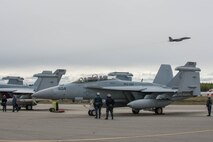 U.S. Navy Sailors from VAQ-137, Naval Air Station Whidbey Island, Washington, watch over an EA-18G Growler aircraft while other  May 9, 2016 during RED-FLAG-Alaska 16-1 at Eielson Air Force Base, Alaska. More than 40 Sailors from VAQ-137 are augmenting RF-A, a Pacific Air Forces command directed field training exercise for U.S. and allied forces, to provide joint offensive counter-air, interdiction, close air support and large force employment training in a simulated combat environment. (U.S. Air Force photo by Staff Sgt. Shawn Nickel/Released)
