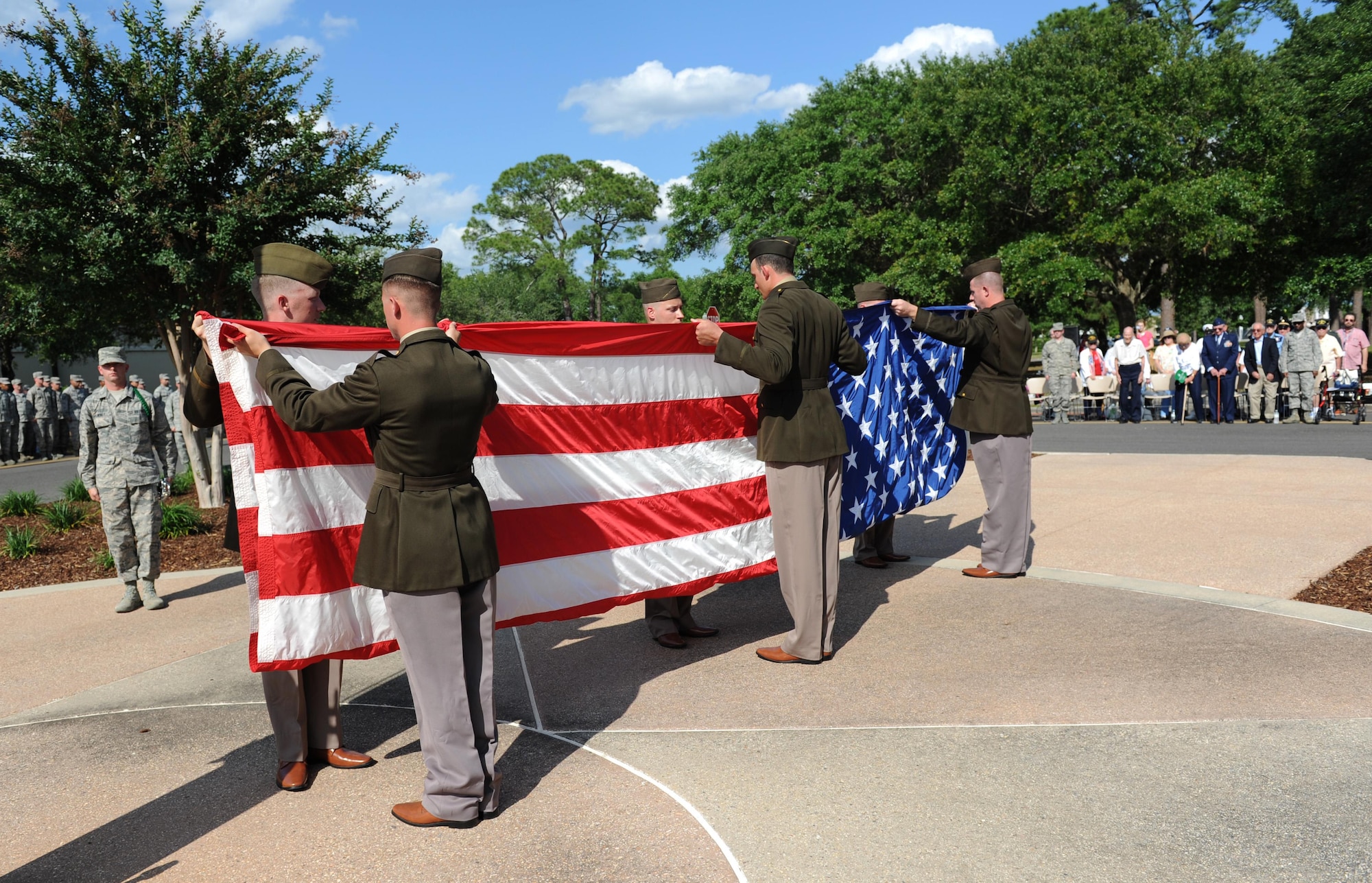81st Security Forces Squadron Combat Arms Training and Maintenance members fold the U.S. flag during the Lt. Samuel Reeves Keesler, Jr. Memorial Retreat Ceremony May 13, 2016, Keesler Air Force Base, Miss. The event was held in honor of Lt. Keesler’s date of entry into the Army Air Service 99 years ago. The retreat ceremony is part of a year-long celebration of Lt. Keesler, a Mississippi native and WORLD WAR I hero, and the 75th anniversary of the opening of the base. (U.S. Air Force photo by Kemberly Groue)