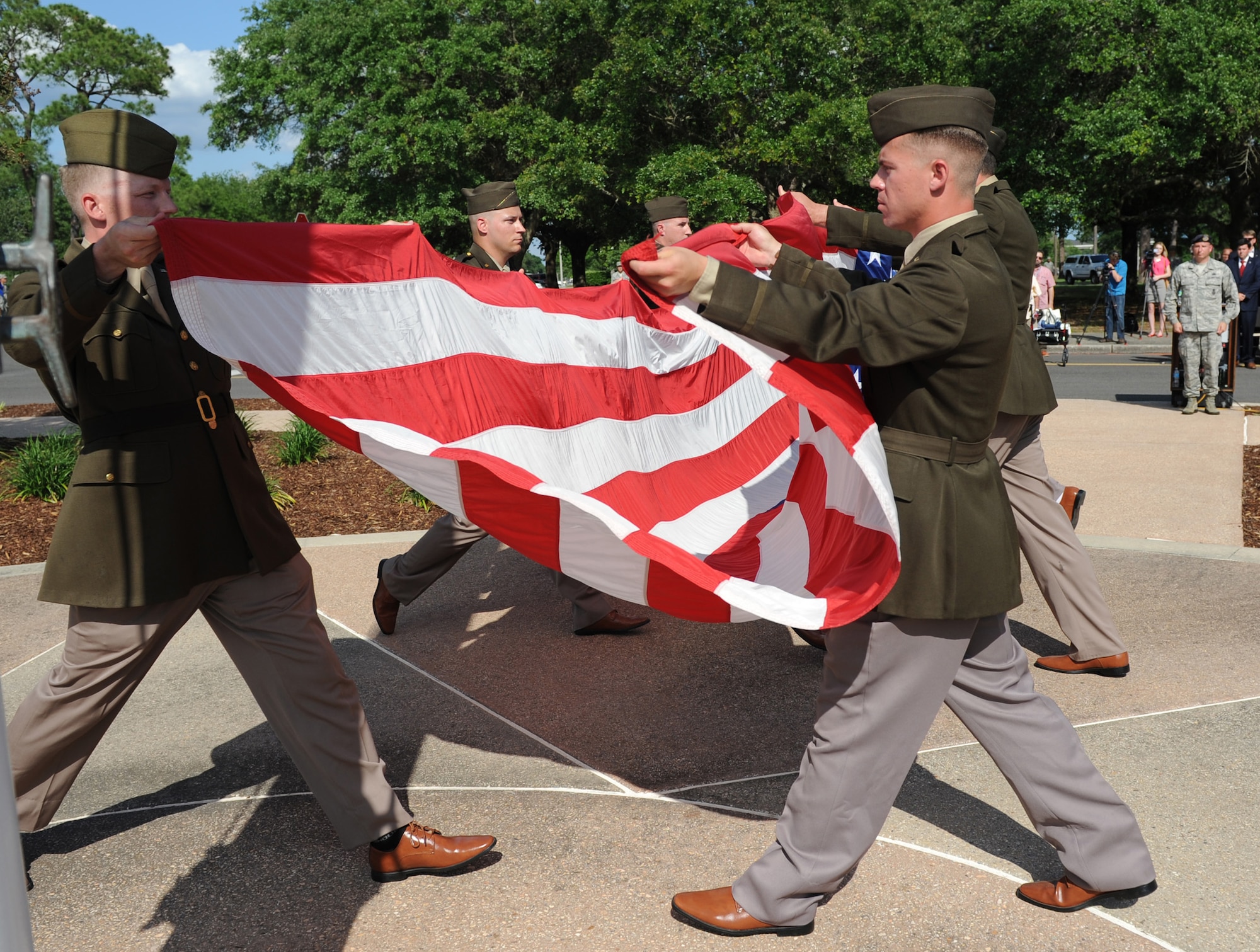 81st Security Forces Squadron Combat Arms Training and Maintenance members fold the U.S. flag during the Lt. Samuel Reeves Keesler, Jr. Memorial Retreat Ceremony May 13, 2016, Keesler Air Force Base, Miss. The event was held in honor of Lt. Keesler’s date of entry into the Army Air Service 99 years ago. The retreat ceremony is part of a year-long celebration of Lt. Keesler, a Mississippi native and WORLD WAR I hero, and the 75th anniversary of the opening of the base. (U.S. Air Force photo by Kemberly Groue)