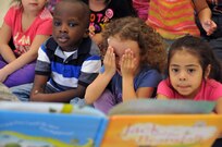 Sgt. Russell Toof, a public affairs specialist assigned to the U.S. Army Reserve's 326th Mobile Public Affairs Detachment in Reading, Pennsylvania, reads to children at a preschool in Clementon, New Jersey May 12 as part of a military appreciation day at the school.