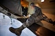 Tech. Sgt. Paul Carissimo, 932nd Maintenance Squadron, looks over the list of areas to inspect during a routine inspection of a C-40c cargo/luggage bay May 2, 2016, Scott Air Force Base, Illinois.  (U.S. Air Force photo by Christopher Parr)