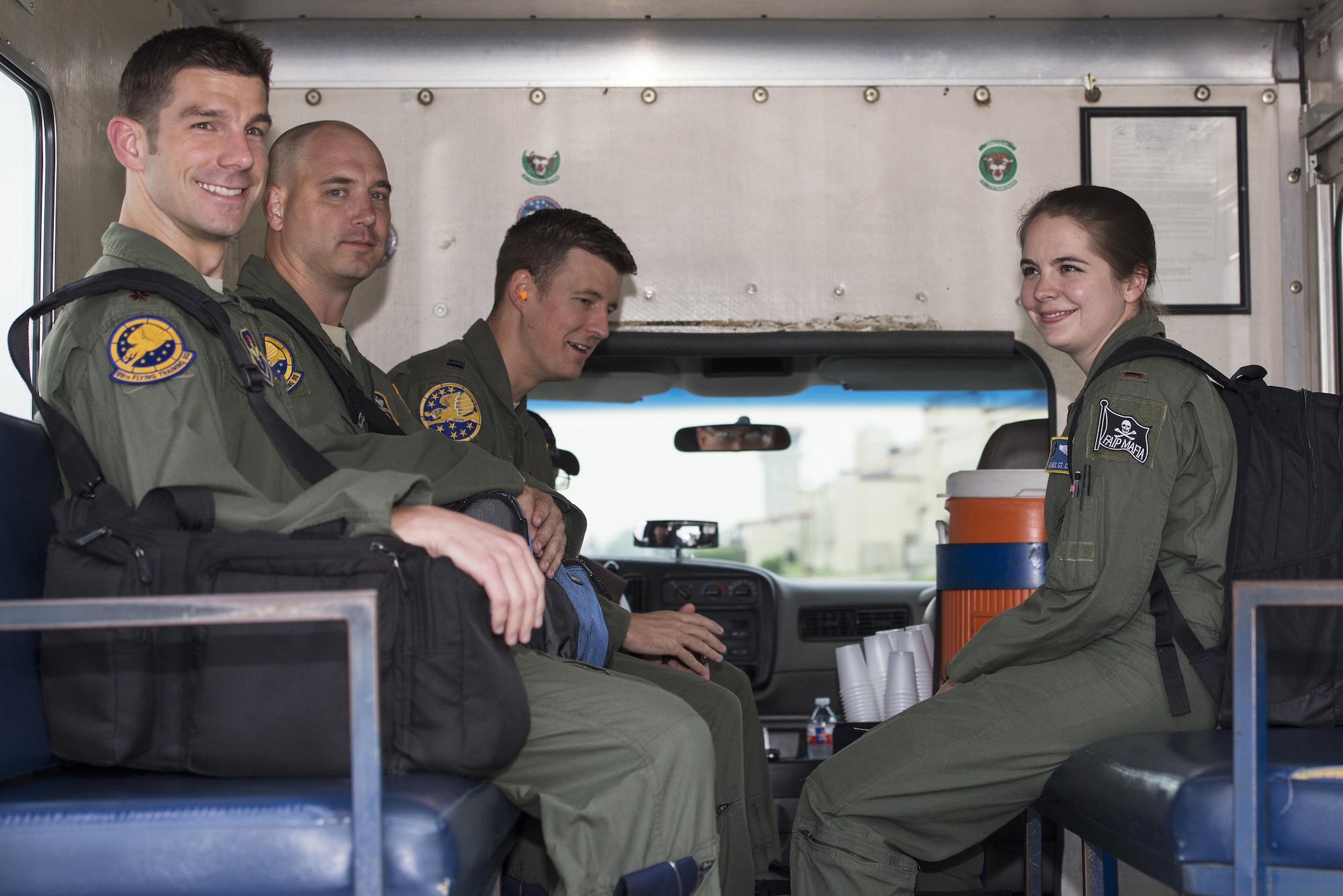 Left to right: Maj. Ryan Scott, 99th Flying Training Squadron “A” flight commander and T-1A Jayhawk instructor pilot, Maj. Brian Boettger, 99th FTS T-1A instructor pilot, Capt. Brad Davis, 99th FTS instructor pilot trainee and 2nd Lt. Aimee St. Cyr, 99th FTS instructor pilot trainee, are transported to their aircraft on the flightline of Joint Base San Antonio-Randolph May 12, 2016. This year marks the 23rd anniversary of the 99th FTS using the T-1A to train instructor pilots at JBSA-Randolph.