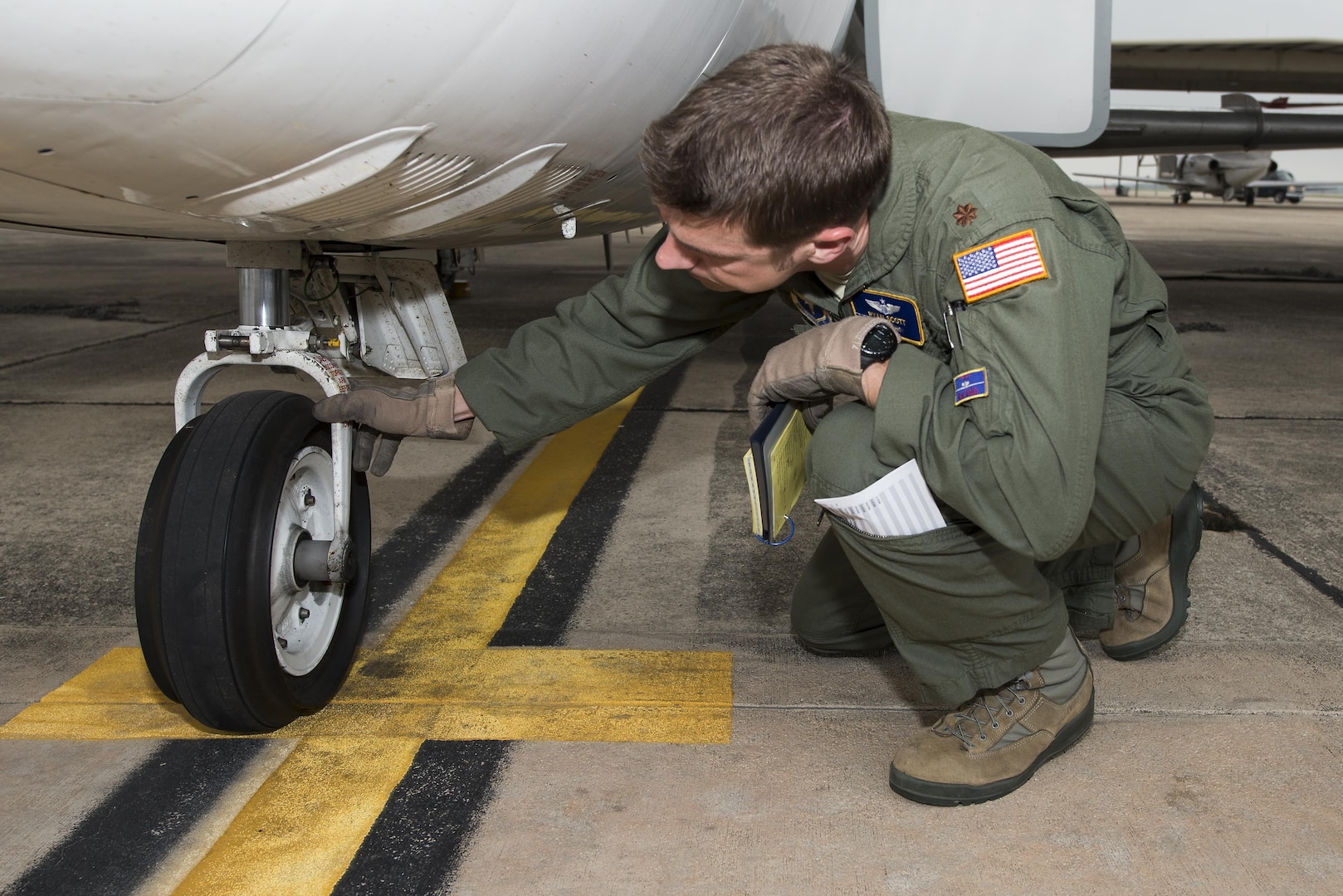 Maj. Ryan Scott, 99th Flying Training Squadron “A” flight commander and T-1A Jayhawk instructor pilot, performs pre-flight checks on a T-1A before a training mission at Joint Base San Antonio-Randolph May 16, 2016. Instructor pilot trainees who attend pilot instructor training at JBSA-Randolph combine to fly 8,500 hours a year and 80 sorties per week.