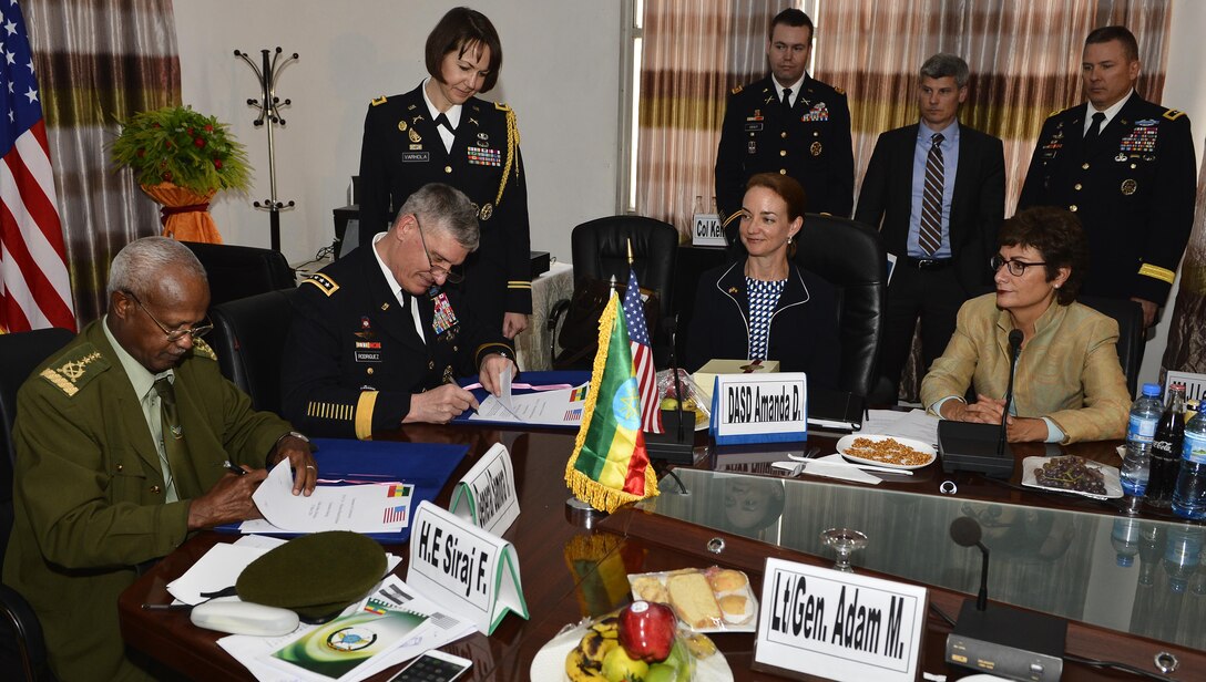 Army Gen. David M. Rodriguez, commander of Stuttgart, Germany-based U.S. Africa Command; and Gen. Samora Yunis, Chief of Staff Ethiopian National Defense Force, sign the summary of conclusions after a Bilateral Defense Committee meeting in Addis Ababa, Ethiopia, March 31, 2016. Rodriguez works with military leaders across the continent to build capabilities and encourage multinational coalitions. Air Force photo by Tech. Sgt. Dan DeCook