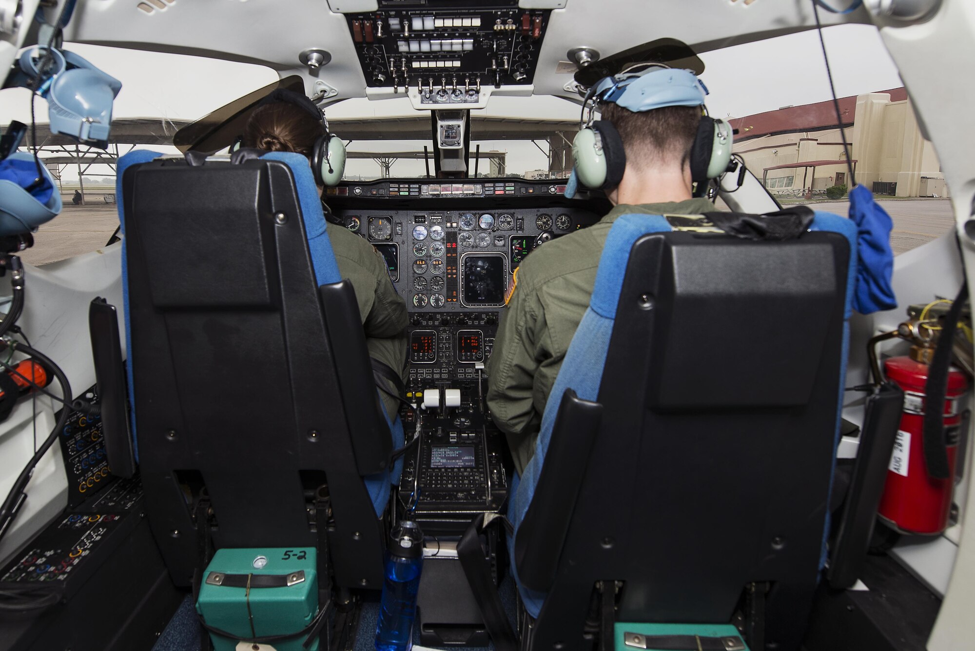 Maj. Ryan Scott, 99th Flying Training Squadron “A” flight commander and T-1A Jayhawk instructor pilot, and 2nd Lt. Aimee St. Cyr, 99th FTS instructor pilot trainee, go through pre-flight procedures before a training mission at Joint Base San Antonio-Randolph May 16, 2016. The training mission consisted of Scott and St. Cyr performing simulated air refueling and airdrops.