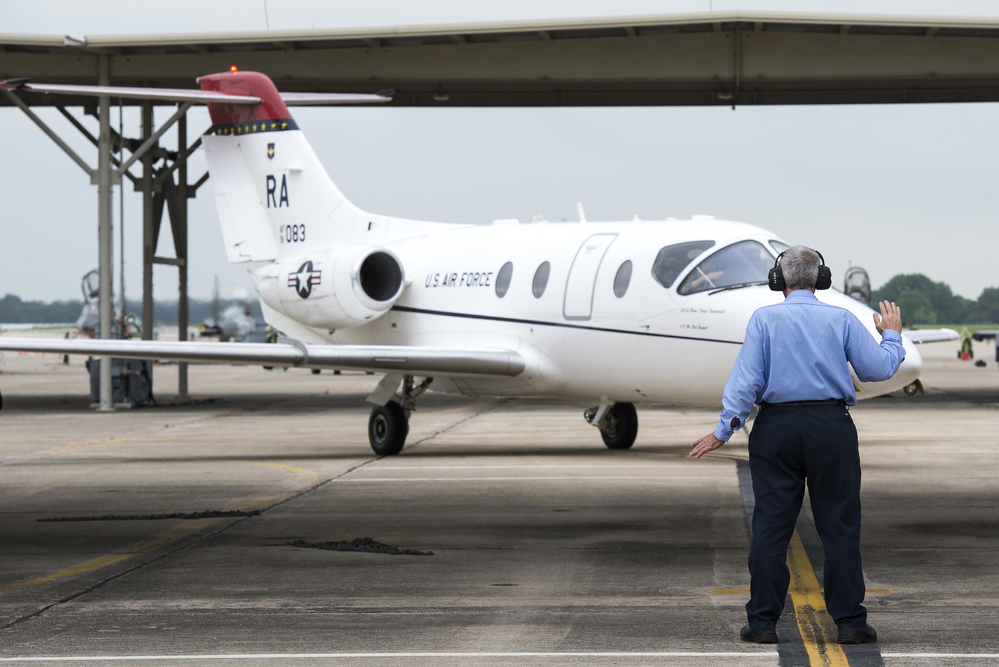 Maj. Ryan Scott, 99th Flying Training Squadron “A” flight commander and T-1A Jayhawk instructor pilot, and 2nd Lt. Aimee St. Cyr, 99th FTS instructor pilot trainee, taxi back on to the flightline after completing a training mission at Joint Base San Antonio-Randolph May 16, 2016. The T-1A’s tails are painted red in tribute to the Tuskegee Airmen who were nicknamed the “Red Tails.”