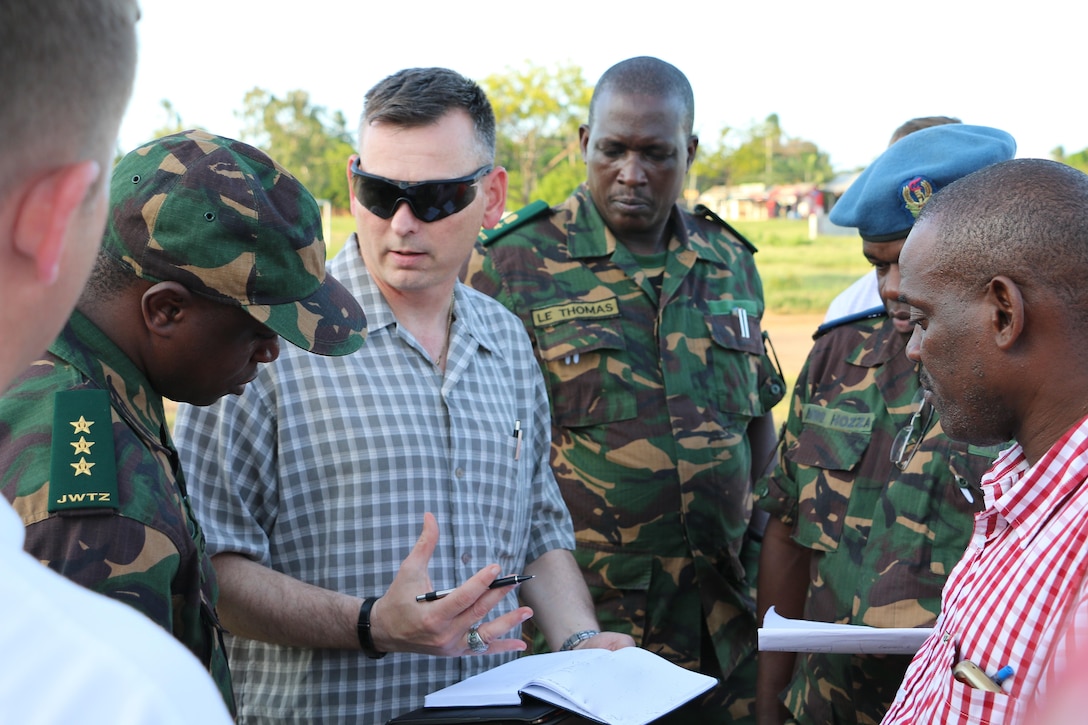 Army Command Sgt. Maj. James Santos, 1st Battalion, 9th Field Artillery Regiment, 2nd Brigade Combat Team, 3rd Infantry Division, discusses the exercise Eastern Accord 2016 training site layout with members of the Tanzanian People’s Defense Force at the Tanzanian Peacekeeping Training Center in Dar es Salaam, May 3, 2016. U.S. personnel work closely with African allies to build capabilities, said U.S. Africa Command commander, Army Gen. David M. Rodriguez. Army photo by Capt. Jarrod Morris