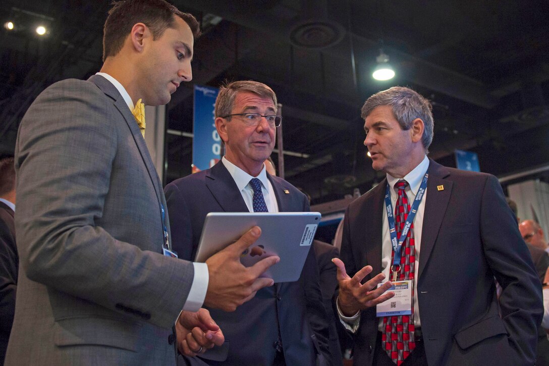 Defense Secretary Ash Carter speaks with an exhibitor during the Navy League's Sea-Air-Space Exposition at National Harbor, Md., May 17, 2016. DoD photo by Air Force Senior Master Sgt. Adrian Cadiz