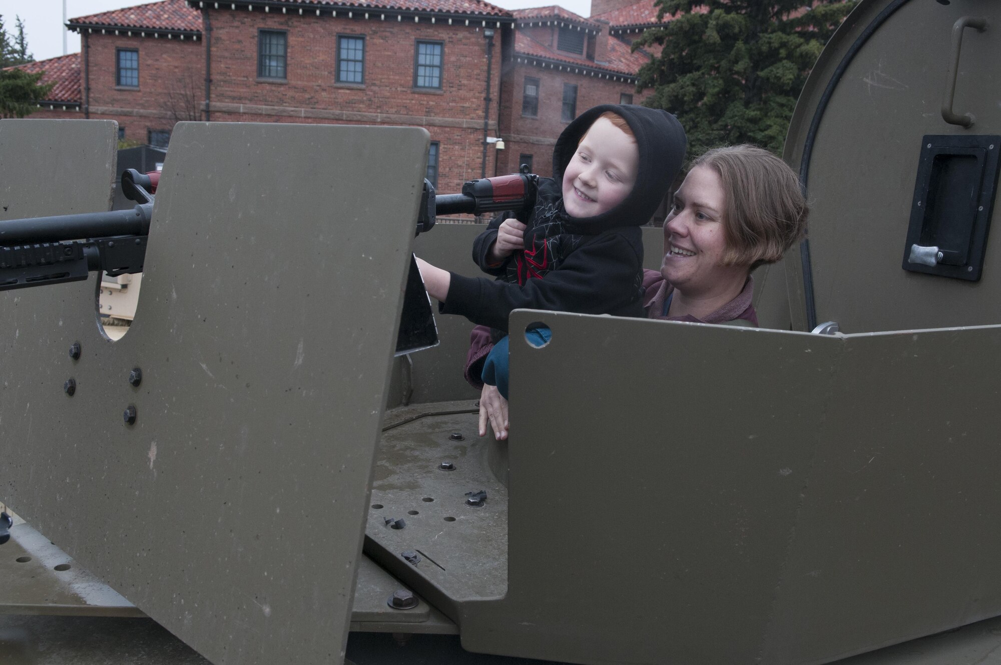 Liam White, 5, and his mother, Elizabeth, sit in a BearCat armored vehicle gunner’s seat during the city’s annual Armed Forces Day celebration at the Cheyenne, Wyo., Veterans Administration Medical Center May 14, 2016. The 90th Security Forces Group brought the BearCat and other equipment to showcase the unique mission set they have at F.E. Warren Air Force Base. Local families were able to check out the interior of security forces vehicles. (U.S. Air Force photo by Airman 1st Class Malcolm Mayfield)