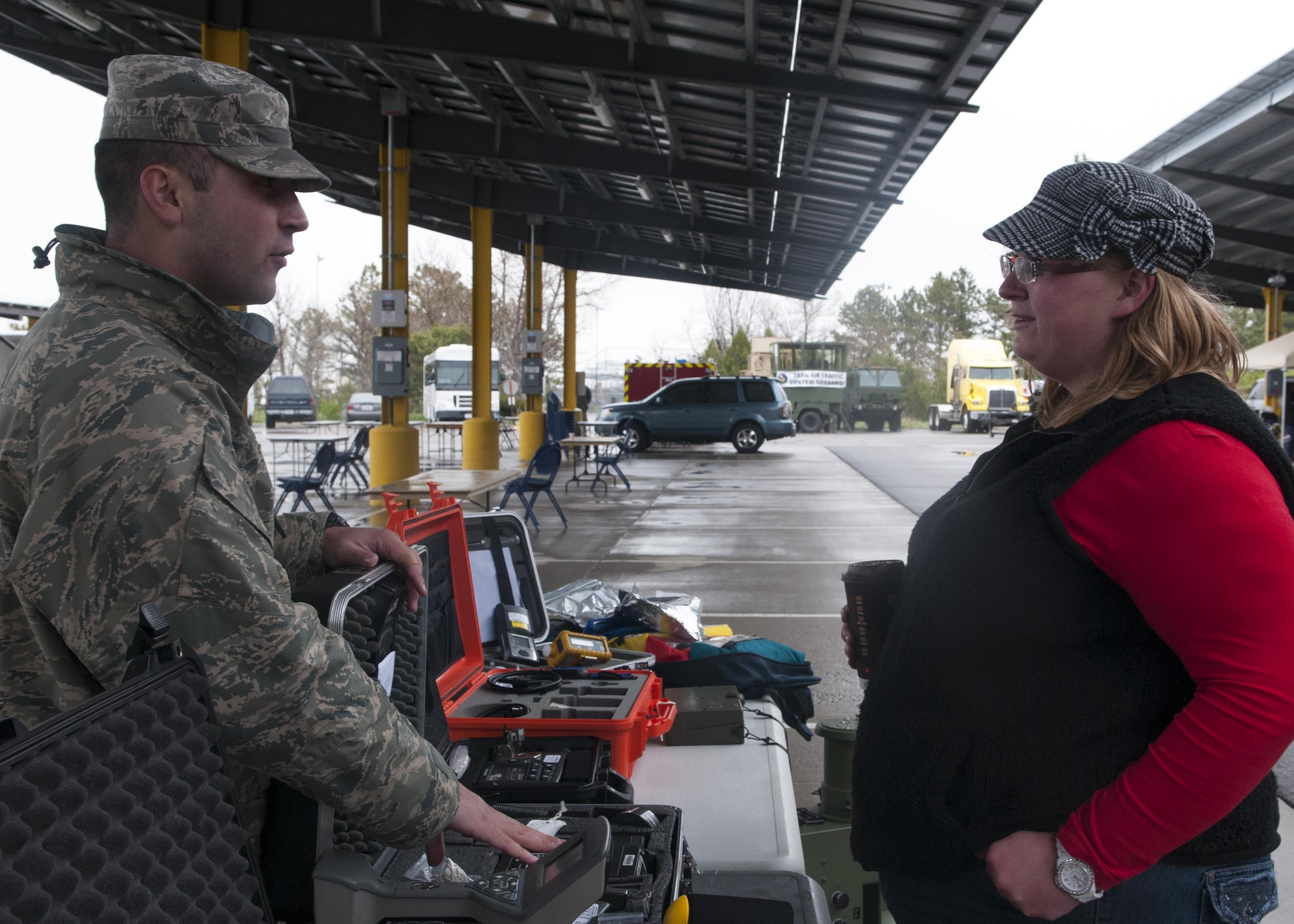 Senior Airmen John Zuhlke, 90th Medical Operations Squadron bioenvironmental engineer, explains to Christie Herron, Cheyenne Minuteman Sales representative, the purpose of different items used by the 90th Medical Group personnel during the city’s annual Armed Forces Day celebration at the Cheyenne, Wyo., Veterans Administration Medical Center May 14, 2016. Dozens of Airmen from F.E. Warren Air Force Base provided support to the event through setup, displays and manning booths. (U.S. Air Force photo by Airman 1st Class Malcolm Mayfield)