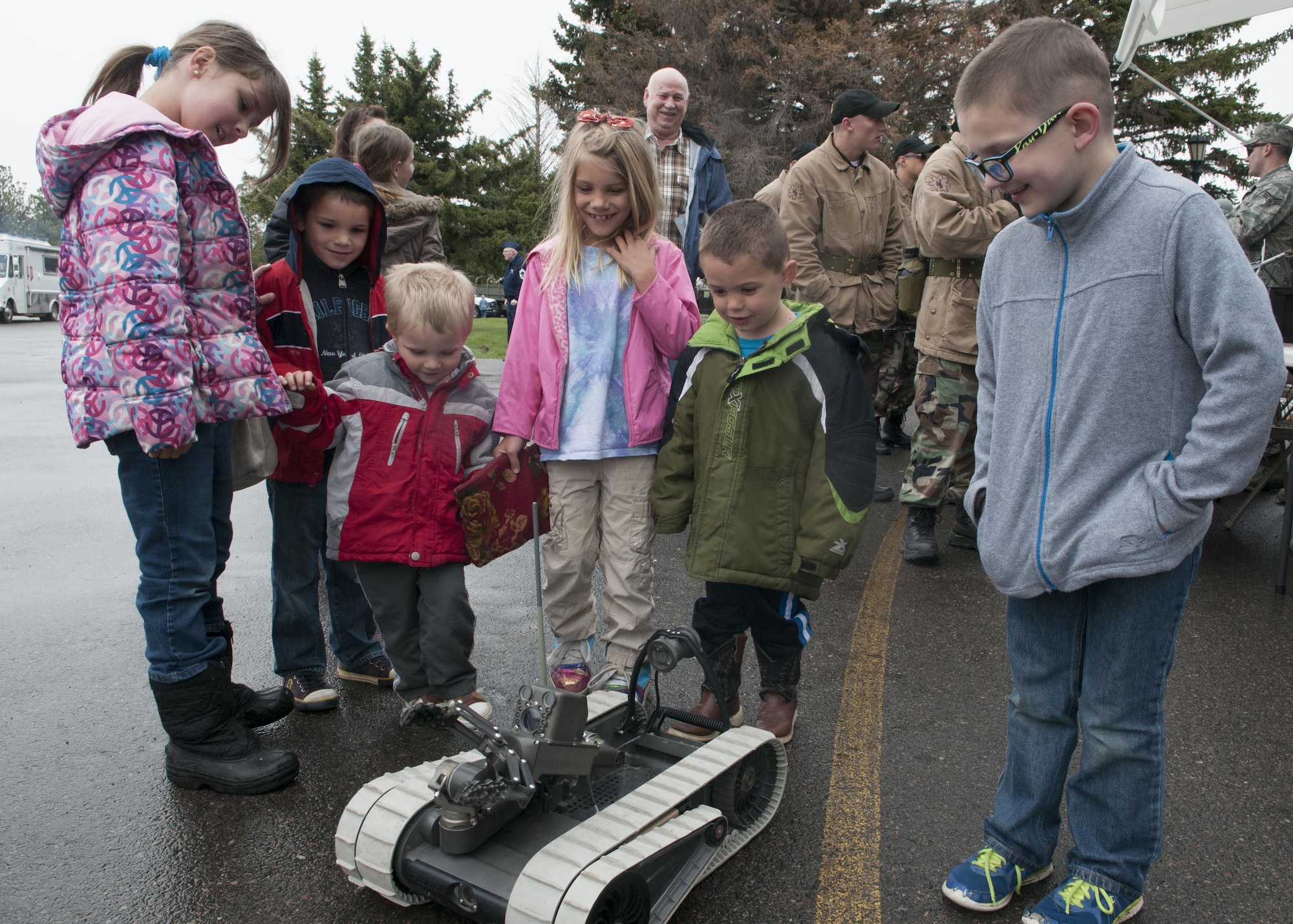 Children gather around the 90th Civil Engineers Squadron Explosive Ordnance Disposal Pacbot 310 during the city’s annual Armed Forces Day celebration at the Cheyenne, Wyo., Veterans Administration Medical Center May 14, 2016. Several units from F.E. Warren Air Force Base, that include the 90th Medical Group and 90th Security Forces Group, showcased their capabilities and equipment to the local community. (U.S. Air Force photo by Airman 1st Class Malcolm Mayfield)