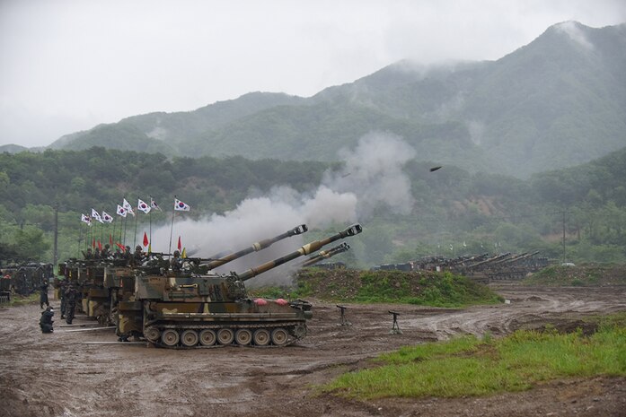 YEONCHEON, South Korea (May 10, 2016) - South Korean Soldiers from the 231st Field Artillery Battalion, 26th Mechanized Infantry Division Artillery, coordinate fires during a joint artillery exercise with U.S. Soldiers from the 1st Battalion, 82nd Field Artillery Regiment, 1st Armored Brigade Combat Team, 1st Cavalry Division. The exercise, less than six miles from the Demilitarized Zone that separates North and South Korea, involved 30 self-propelled artillery from the U.S. and South Korea. 
