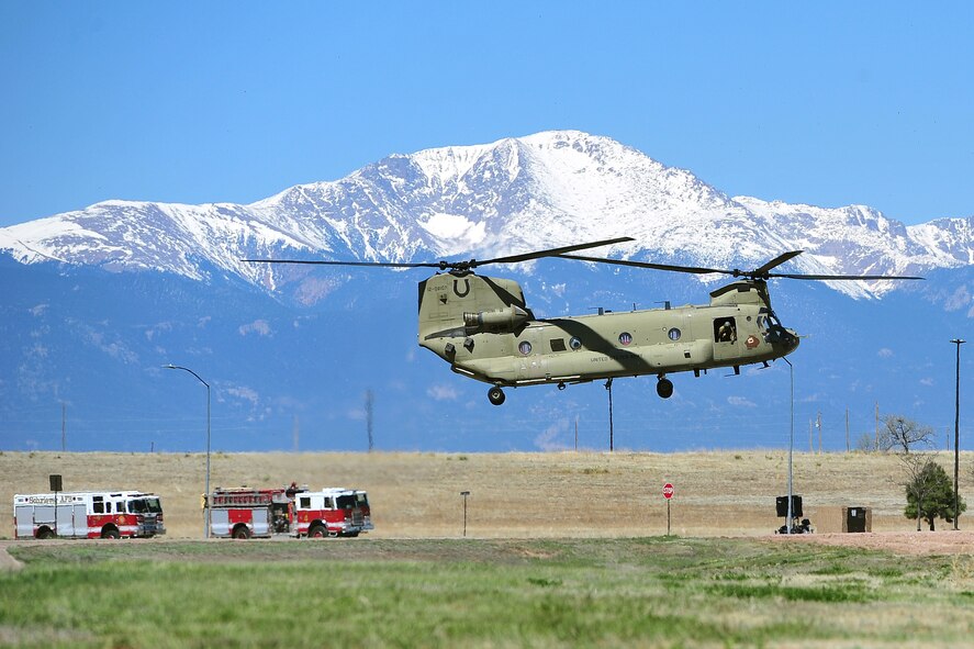A Fort Carson CH-47 helicopter lands at Schriever Air Force Base, Colorado, Thursday, May 12, 2016, to provide transportation for Defense Secretary Ashton Carter following his tour of the Joint Interagency Combined Space Operations Center. The center provides the Department of Defense and the intelligence community with a robust test and experimentation environment to better integrate our space operations in response to threats and afford unity of effort between diverse space communities. (U.S. Air Force Photo/Kathryn Calvert)