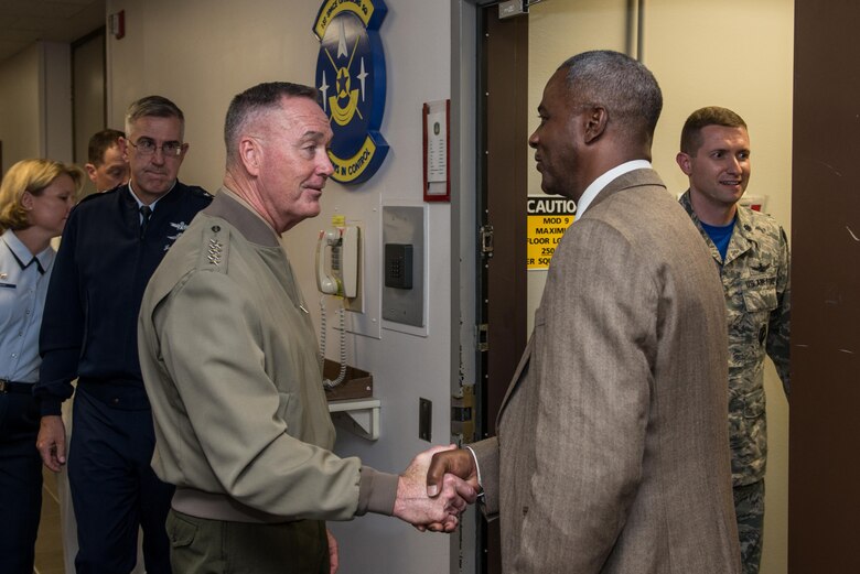 Anthony Little, 1st Space Operations Squadron, greets Gen. Joseph Dunford, Chairman of the Joint Chiefs of Staff, for a Geosynchronous Space Situational Awareness Operations brief at Schriever Air Force Base, Colorado, Friday, May 13, 2016.  The visit to 1 SOPS was the second stop on the tour for Dunford after he visited the Joint Interagency Combined Space Operations Center. (U.S. Air Force photo/Christopher DeWitt)