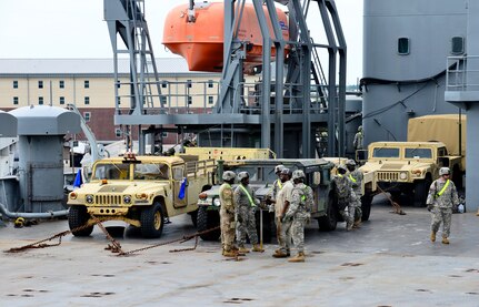 Soldiers from Fort Stewart Ga. load Humvees onto the M/V Cape Decision ship during a Sealift Emergency Deployment Exercise at the Joint Base Charleston Federal Law Enforcement Training Center, May 10, 2016. During the exercise, the Soldiers moved and secured more than 90 vehicles aboard the M/V Cape Decision ship. (U.S. Air Force Photo/Airman Megan Munoz)