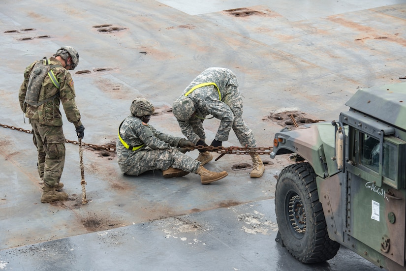 Soldiers from Fort Stewart, Ga. secure a Humvee to the M/V Cape Decision ship during a Sealift Emergency Deployment Exercise at the Joint Base Charleston Federal Law Enforcement Training Center, May 10, 2016. For many Soldiers, this was the first time participating in a SEDRE. (U.S. Air Force Photo/Airman Megan Munoz)