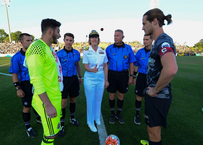 Commander, Naval Heath Clinic Charleston, Capt. Elizabeth Maley participated in the coin flip to begin the Charleston Battery Soccer game for their military appreciation night May 14, 2016, Charleston, S.C. The Charleston Battery cruised past Toronto FCII in a 2-0 victory. (U.S. Navy Photo by Mass Communication Specialist 1st Class Sean M. Stafford/Released)