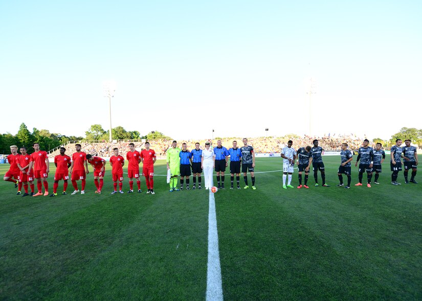 Commander, Naval Heath Clinic Charleston, Capt. Elizabeth Maley participated in the coin flip to begin the Charleston Battery Soccer game for their military appreciation night May 14, 2016, Charleston, S.C. The Charleston Battery cruised past Toronto FCII in a 2-0 victory. (U.S. Navy Photo by Mass Communication Specialist 1st Class Sean M. Stafford/Released)