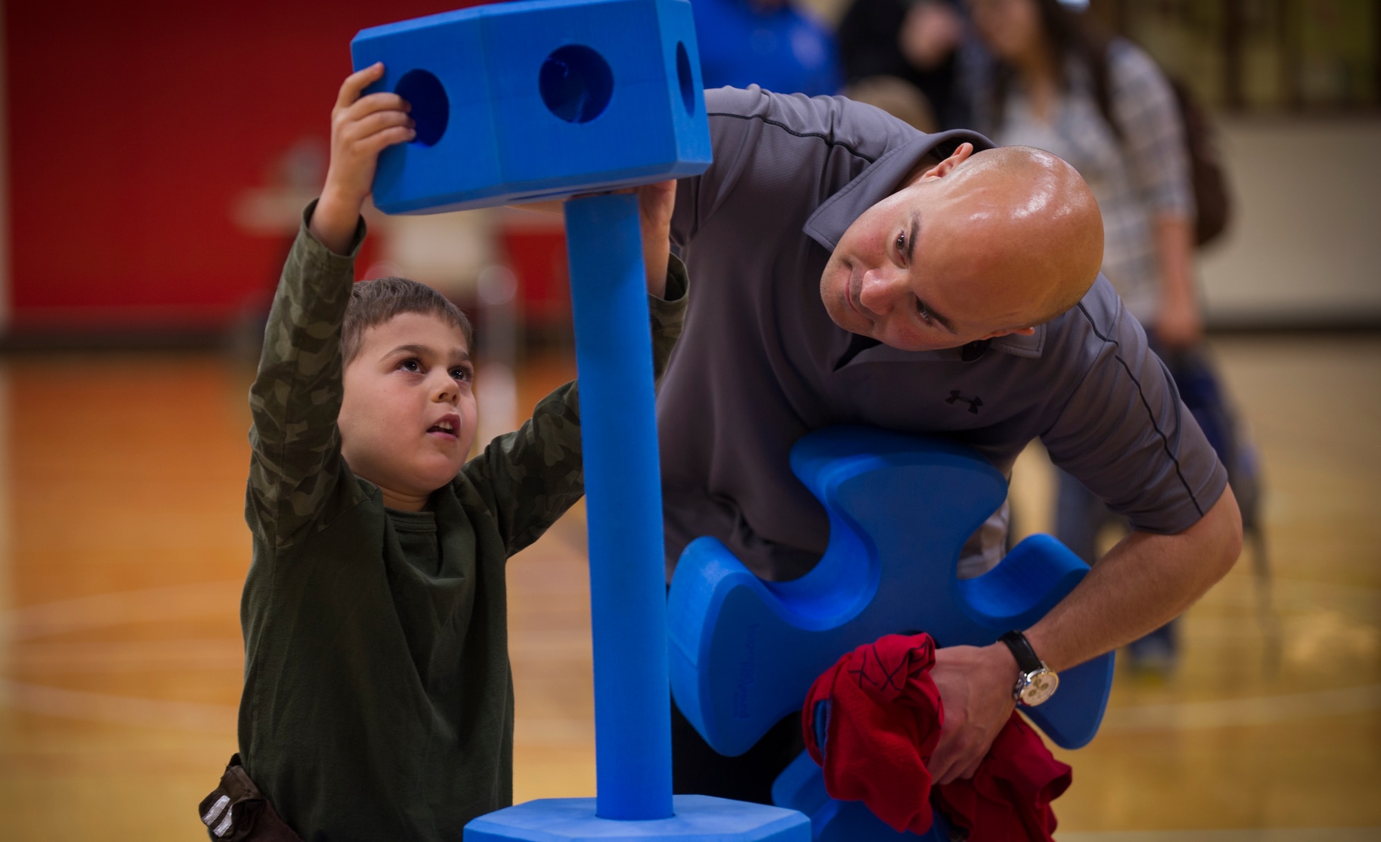 A child builds something during the STEM Symposium at the Minot YMCA in Minot, N.D., May 14, 2016. The purpose of the symposium was to teach children about the science and technology used at Minot Air Force Base. (U.S. Air Force photo/Senior Airman Apryl Hall)