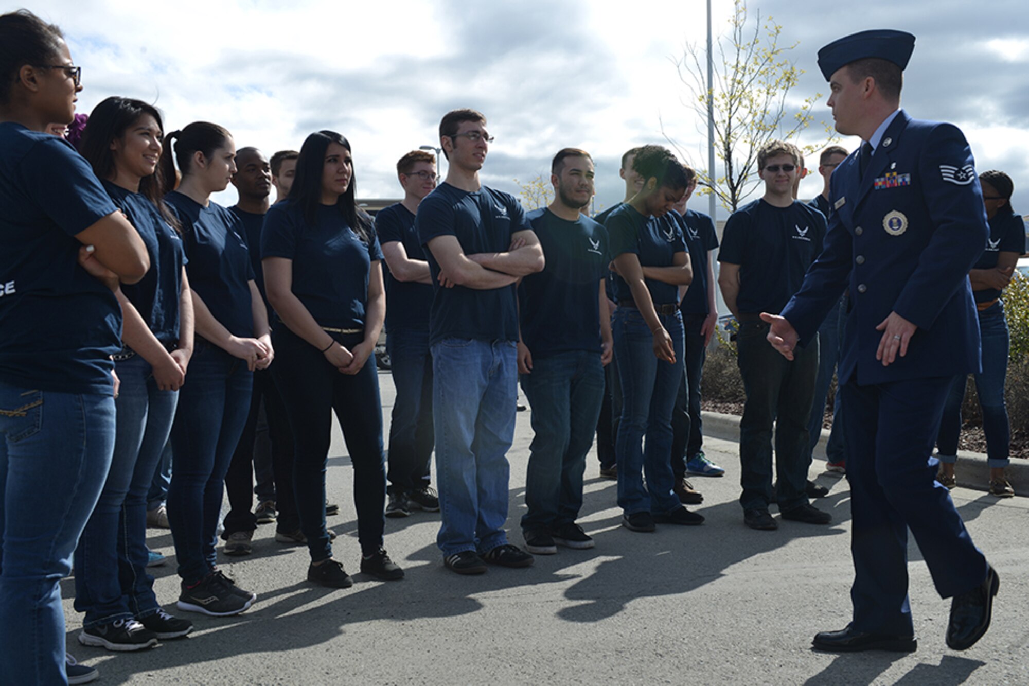 Air Force Staff Sgt. Casey Prine, 361st Recruiting Squadron recruiter, reviews the oath of enlistment with soon-to-be Air Force enlistees at the Air Force recruiting station ribbon cutting at Glenn Square Mall in Anchorage, Alaska, May 10, 2016. Army Lt. Col. John Gaivin, 17th Combat Sustainment Support Battalion commander, directed 27 recruits in performing the oath of enlistment. (U.S. Air Force photo by Airman 1st Class Javier Alvarez)