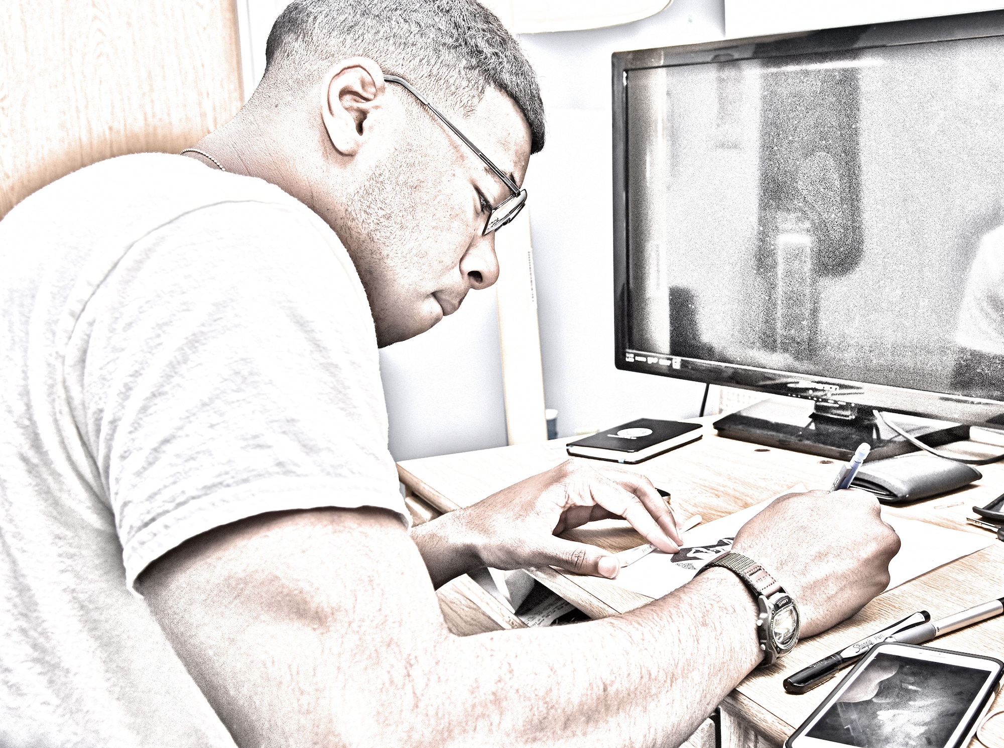 Airman 1st Class James W. Landrum IV, 341st Medical Operations Squadron medical aerospace technician, draws a self-portrait at Malmstrom Air Force Base, Mont., May 15, 2016. Landrum is part of a long line of artists dating back to his great-grandfather, who was an artist during the Harlem Renaissance. (U.S. Air Force photo illustration/Senior Airman Jaeda Tookes)