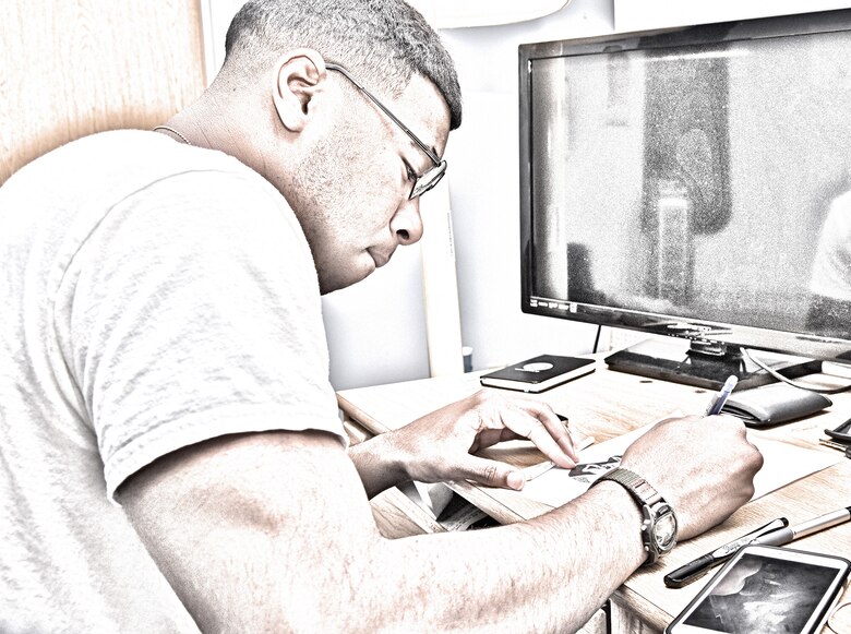 Airman 1st Class James W. Landrum IV, 341st Medical Operations Squadron medical aerospace technician, draws a self-portrait at Malmstrom Air Force Base, Mont., May 15, 2016. Landrum is part of a long line of artists dating back to his great-grandfather, who was an artist during the Harlem Renaissance. (U.S. Air Force photo illustration/Senior Airman Jaeda Tookes)