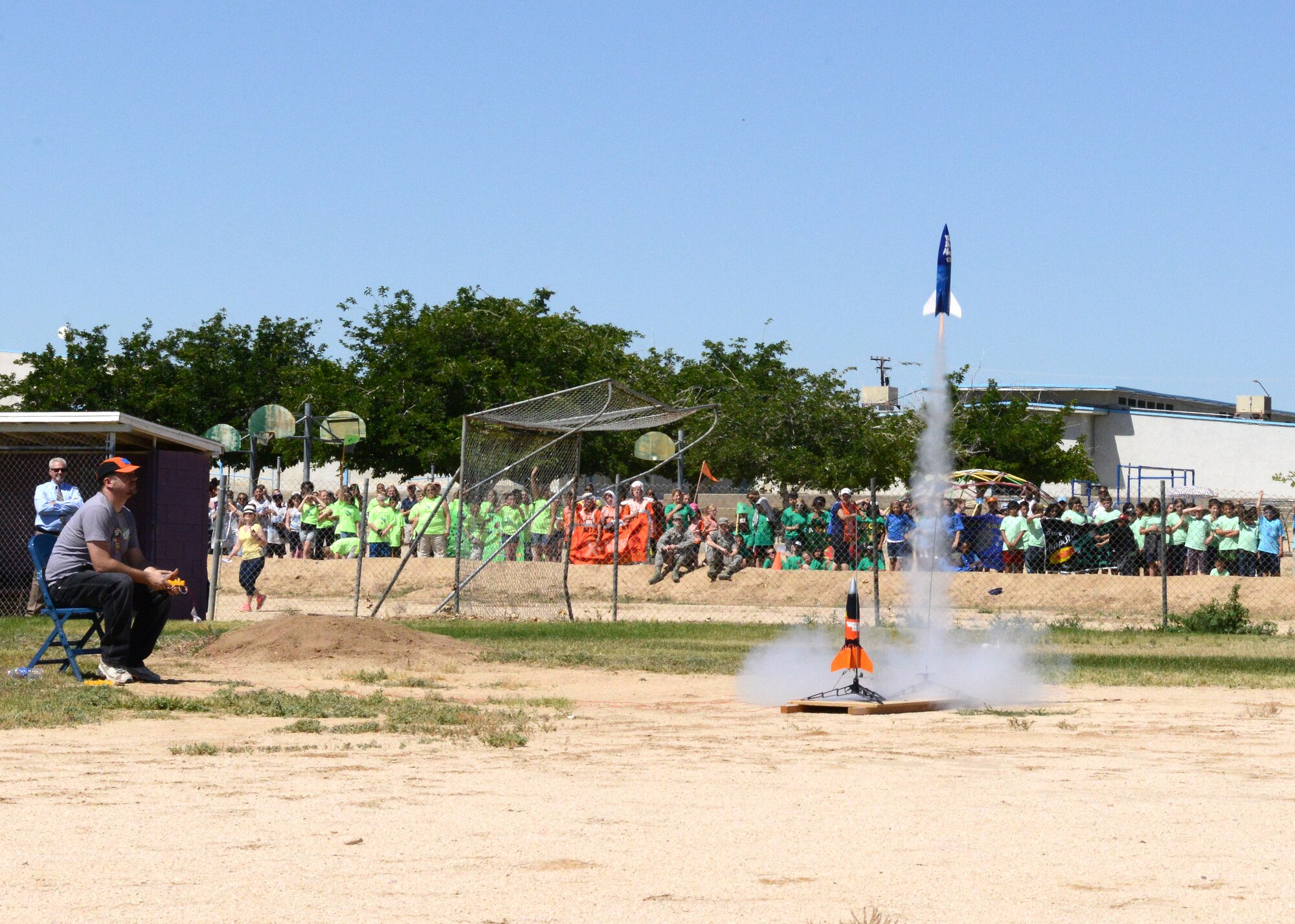 Students cheered as the rockets they built were launched into the sky May 12. One after another, rockets blasted off from Desert High School's junior varsity baseball field for Branch Elementary School's 4th Annual Intermediate Space Challenge. (U.S. Air Force photo by Kenji Thuloweit)