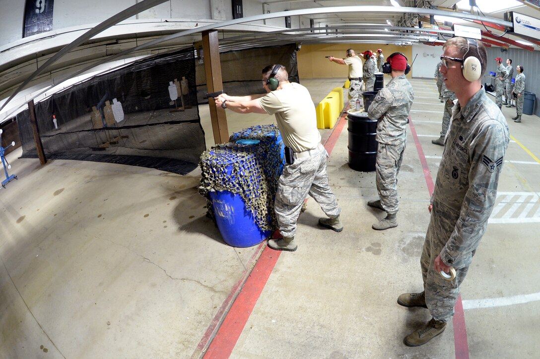 Hill Air Force Base Airmen participate in a shooting competition May 10 at the Hil Air Force Base firing range. The competition, a part of National Police Week activities, was hosted by the 75th Security Forces Combat Arms Section. (U.S. Air Force photo by Todd Cromar)