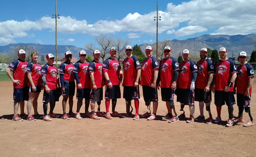 Members of the Wounded Warrior Amputee Softball team pose for a photo between games. (courtesy photo)
