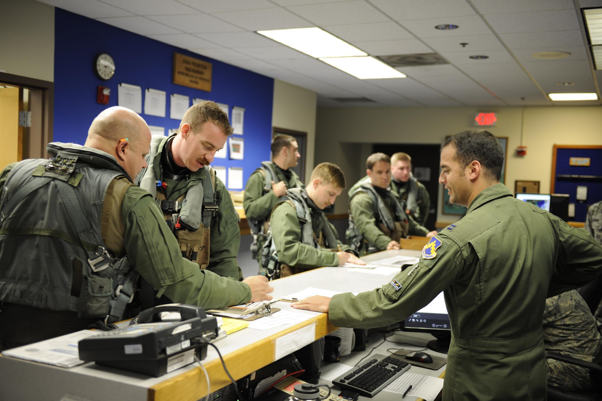 F-16 Fighting Falcon pilots from the 35th Fighter Squadron, receives their step briefing at Kunsan Air Base, Republic of Korea, during Buddy Wing 16-4, May 11, 2016. Buddy Wing exercises are conducted at various ROKAF and U.S. Air Force bases multiple times throughout the year in order to practice interoperability between the U.S. and the ROKAF. (U.S. Air Force photo by Senior Airman Dustin King/Released)