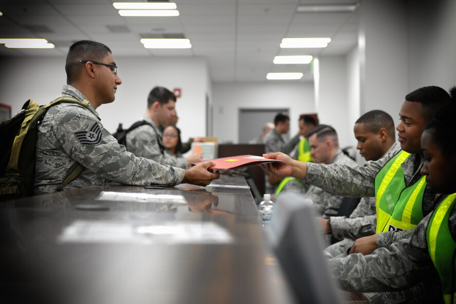 Tech. Sgt. Ralph Oliver, 374th Operations Support Squadron joint airdrop inspector,
processes through a deployment line May 13, 2016, during a humanitarian aid and
disaster relief exercise at Yokota Air Base, Japan. Multiple chalks of personnel
processed through the deployment line, representing possible support provided in
response to a humanitarian emergency. The 374th Airlift Wing and partner units
conducted a humanitarian aid and disaster relief exercise throughout the week, testing
the base's planning and response actions. (U.S. Air Force photo by Staff Sgt. Cody H.
Ramirez/Released)