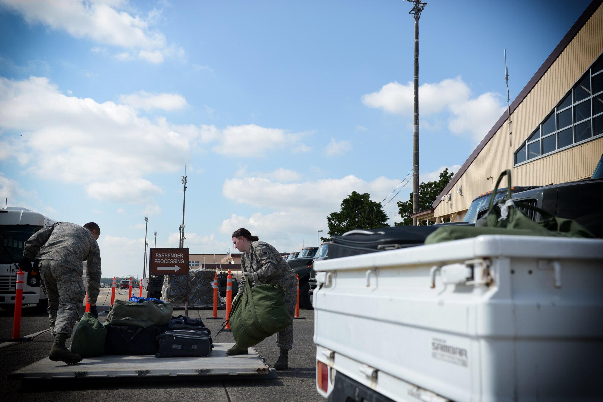Airman 1st Class Kristopher Wrentmore and Airman 1st Class Carolynn Stephens, both
with the 374th Logistics Readiness Squadron, unload bags from a pallet at Yokota Air
Base, Japan, May 13, 2016. Yokota practiced their humanitarian aid and disaster relief
capabilities throughout the week, including a simulated deployment line and departing
flights. The bags belonged to Airmen who represented possible support personnel who
would be utilized during an emergency response situation. (U.S. Air Force photo by
Staff Sgt. Cody H. Ramirez/Released)
