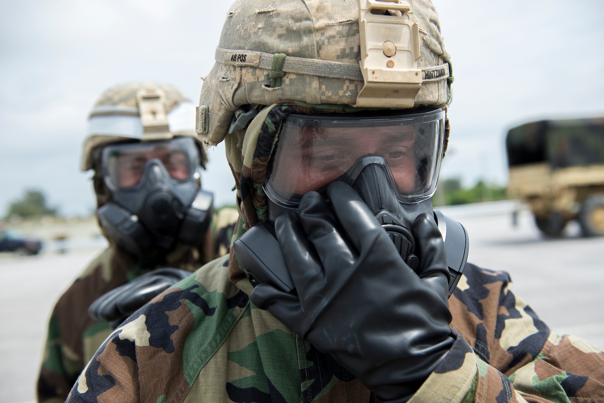 U.S. Army Soldiers from the 1-1 Air Defense Artillery Headquarters and Headquarters Battalion practice personnel decontamination procedures during a joint Exercise May 12, 2016, at Kadena Air Base, Japan. During the training, U.S. Air Force Airmen from the 18th Civil Engineer Squadron’s Readiness and Emergency Management Flight instructed the personnel decontamination, while Soldiers from the 1-1 ADA explained vehicle decontamination. The exercise gave participating Soldiers and Airmen alike a chance to work together to bolster interoperability for the continued support and defense of Okinawa and the Indo-Asia-Pacific region. (U.S. Air Force photo by Staff Sgt. Maeson L. Elleman)