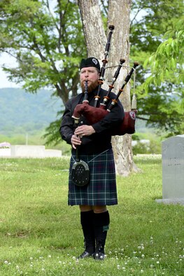 A bagpiper from the Ian Sturrock Pipe Band plays during an annual wreath laying ceremony at the gravesite of Thomas “Pete” Ray April 19, 2016. (U.S. Air National Guard photo by: Senior Master Sgt. Ken Johnson/Released)