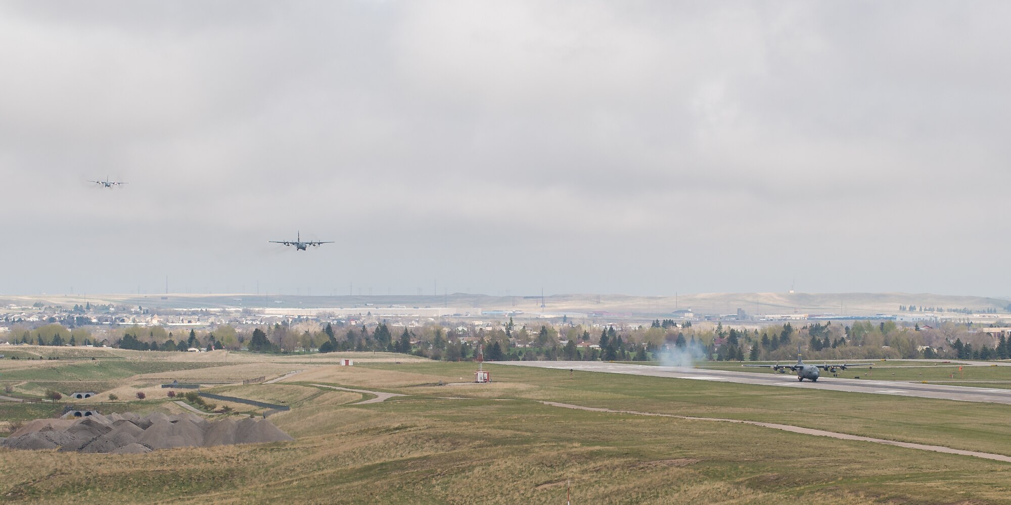 C-130 aircraft assigned to the 153rd Airlift Wing, Wyoming Air National Guard, Cheyenne, prepare to land May 14. The wing took part in a historic event when they successfully launched all eight assigned C-130H aircraft for a training mission - an operation of a scale never before seen in the history of the wing. (U.S. Air National Guard photo by Master Sgt. Charles Delano/released)