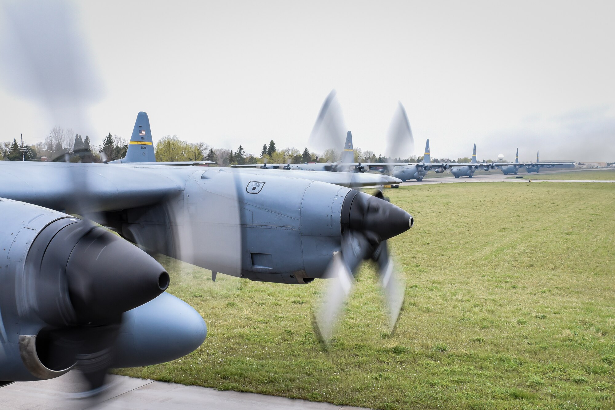All eight assigned C-130H aircraft with the 153rd Airlift Wing, Wyoming Air National Guard, Cheyenne, taxi and prepare to take flight May 14. The wing took part in a historic event when they successfully launched all eight assigned C-130H aircraft for a training mission - an operation of a scale never before seen in the history of the wing. (U.S. Air National Guard photo by Master Sgt. Leisa Grant/released)
