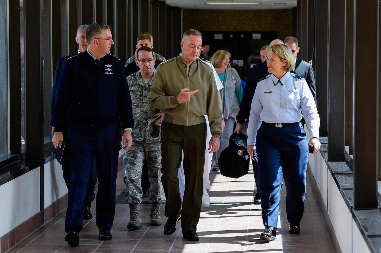 Gen. John Hyten, Air Force Space Command commander, Maj. Gen. Robert Rego, Mobilization Assistant to the Commander, U.S. Strategic Command, Gen. Joseph Dunford, Chairman of the Joint Chiefs of Staff, and Col. DeAnna Burt, 50th Space Wing commander, speak during a visit to the Joint Interagency Combined Space Operations Center at Schriever Air Force Base, Colorado, Friday, May 13, 2016. The center provides the Department of Defense and the intelligence community with a robust test and experimentation environment to better integrate space operations in response to threats and afford unity of effort between diverse space communities. (U.S. Air Force photo/Christopher DeWitt)
