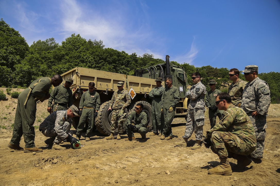 U.S. Marines train alongside U.S. Soldiers during Korea Explosive Ordnance Disposal Exercise, May 14, 2016, at Camp Rodriguez Live Fire Complex, South Korea. The Marines invited the Army to the exercise to increase EOD partnership and exchange different techniques and tactics. The Soldiers are EOD technicians with 718th EOD Company, 23rd Chemical Battalion, 48th Chemical Brigade. The Marines are EOD technicians with 3rd EOD Company, 9th Engineer Support Battalion, 3rd Marine Logistics Group, III Marine Expeditionary Force. (U.S. Marine Corps photo by Cpl. Isaac Ibarra/Released)