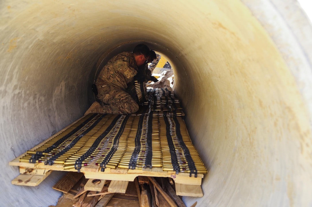 Explosive ordnance disposal technician Marines and Soldiers stage small fire arms to perform burning operations during Korea EOD Exercise, May 14, 2016, at Camp Rodriguez Live Fire Complex, South Korea. Burning operations are used to dispose large amounts of ammunition that can no longer be used. The Soldiers are with 718th EOD Company, 23rd Chemical Battalion, 48th Chemical Brigade. The Marines are with 3rd EOD Company, 9th Engineer Support Battalion, 3rd Marine Logistics Group, III Marine Expeditionary Force. (U.S. Marine Corps photo by Cpl. Isaac Ibarra/Released)