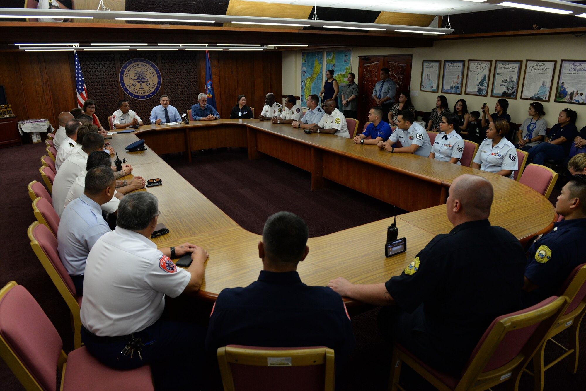 Emergency responders attend a proclamation signing May 16, 2016, at Adelup, Guam. Four Airmen from the 36th Medical Group and 36th Civil Engineer Squadron fire and emergencies services flight received awards in multiple categories including Emergency Medical Technician of the Year and Paramedic of the Year. (U.S. Air Force photo by Airman 1st Class Jacob Skovo)