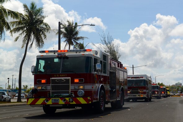 Emergency response teams participate in a parade of lights and sirens through Hagåtña and Adelup, Guam, May 16, 2016. The parade commemorated a proclamation signing, which recognized the week of May 15-21 as Emergency Medical Services Week.  (U.S. Air Force photo by Airman 1st Class Alexa Ann Henderson)
