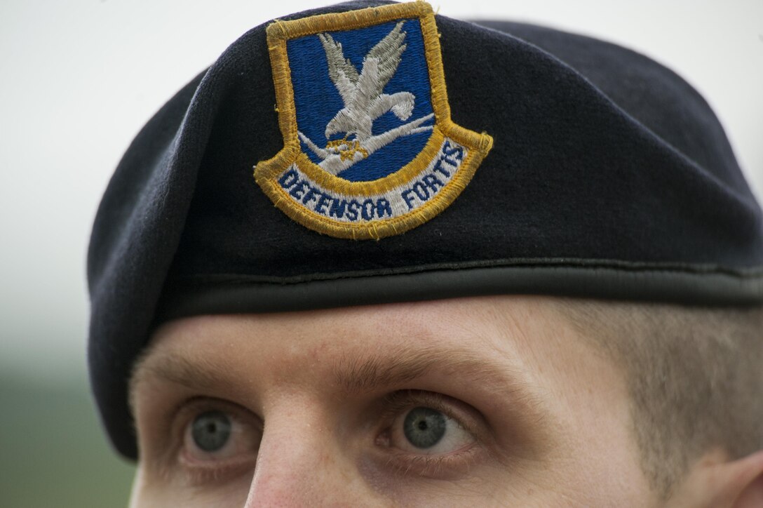 A 52nd Security Forces Airman watches participants compete in the Defender Decathlon during Police Week May 16, 2016, at Spangdahlem Air Base, Germany. The 52nd SFS hosted the event which kicked off a week full of activities to honor the memory of fallen law enforcement officers. (U.S. Air Force photo by Senior Airman Rusty Frank/Released)