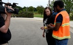 Spc. Victoria Diaz of the Texas National Guard's Joint Task Force 136 (Maneuver Enhancement Brigade) role plays as a disaster evacuee during a training scenario with the Texas Division of Emergency Management to test their new Emergency Tracking Network May 12, 2016, at the Round Rock Armed Forces Reserve Center. The scenario allowed the National Guard and civilian authorities to work together while also creating a training video product for use once the new tracking system goes online June 1. 