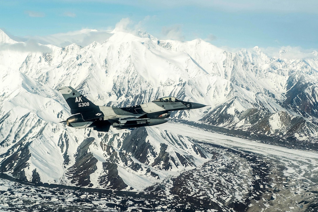 Air Force Maj. Jeromy Guinther flies an F-16 Fighting Falcon over the Joint Pacific Alaska Range Complex, Alaska, during Red Flag 16-1, May 4, 2016. Guinther is a pilot assigned to the 18th Aggressor Squadron. Air Force photo by Staff Sgt. Shawn Nickel