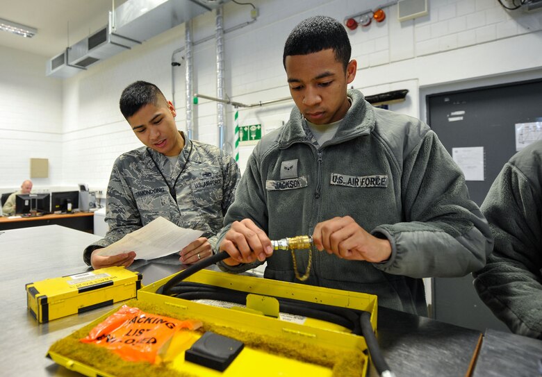 Tech. Sgt. Roscoe Tamondong, 86th Maintenance Group NCO in-charge instructor element, oversees Airman 1st Class Zachary Johnson, 86th Maintenance Squadron crew chief, as he checks out tools to check tire pressures on the C-130J Super Hercules May 17, 2016, at Ramstein Air Base, Germany. Tamondong has been a maintenance qualification training program instructor for over a year, teaching more than 50 students annually. (U.S. Air Force photo/Staff Sgt. Leslie Keopka)