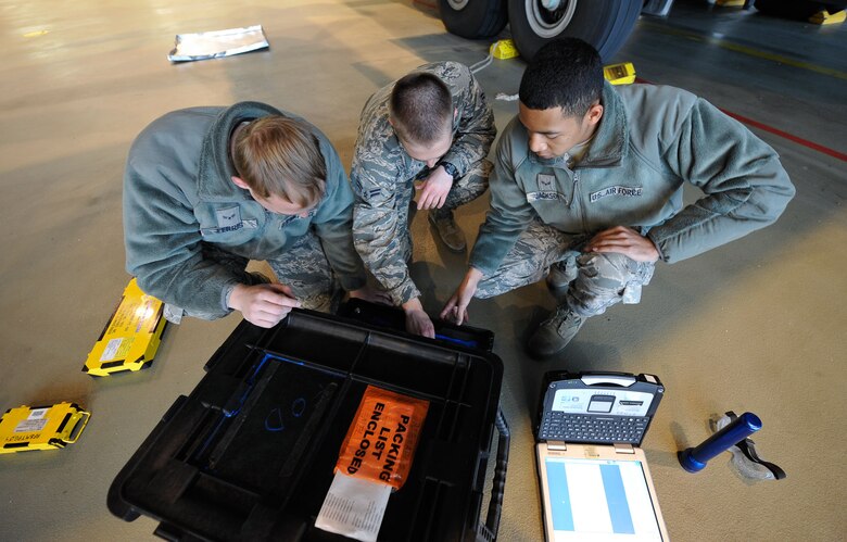 Airmen 1st Class Lukas Ferris, Darren Bunch and Zachary Jackson, 86th Maintenance Squadron crew chief apprentices, check over their tool kit May 17, 2016 at Ramstein Air Base, Germany. The three Airmen are attending a crew chief training course, as part of their upgrade training. (U.S. Air Force photo/Staff Sgt. Leslie Keopka)