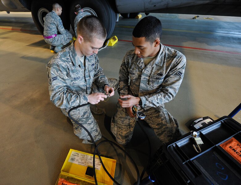 Airmen 1st Class Darren Bunch and Zachary Jackson, 86th Maintenance Squadron crew chief apprentices, check over their tool kit May 17, 2016 at Ramstein Air Base, Germany. The three Airmen are attending a crew chief training course, as part of their upgrade training. (U.S. Air Force photo/Staff Sgt. Leslie Keopka)