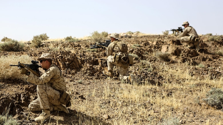 Marines with 1st Battalion, 2nd Marine Regiment, 2nd Marine Division provide patrol security during a squad-level exercise in Al Quweyrah, Jordan, May 14, 2016. Machine gunners and assaultmen occupied support-by-fire positions to assist squads as they advanced on lower ground. 